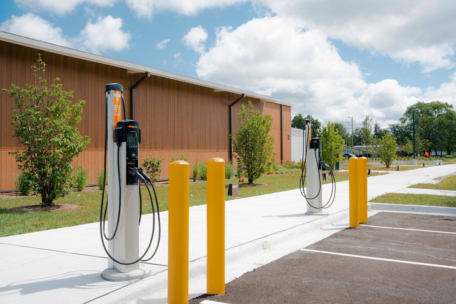 Two parking spaces that include Commercial EV Charging Solutions