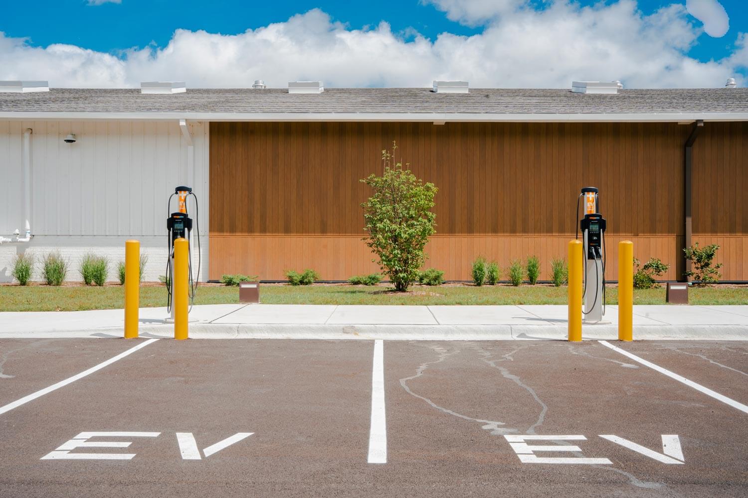 Two parking spaces that include Commercial EV Charging Solutions - Installed By Excel Electric