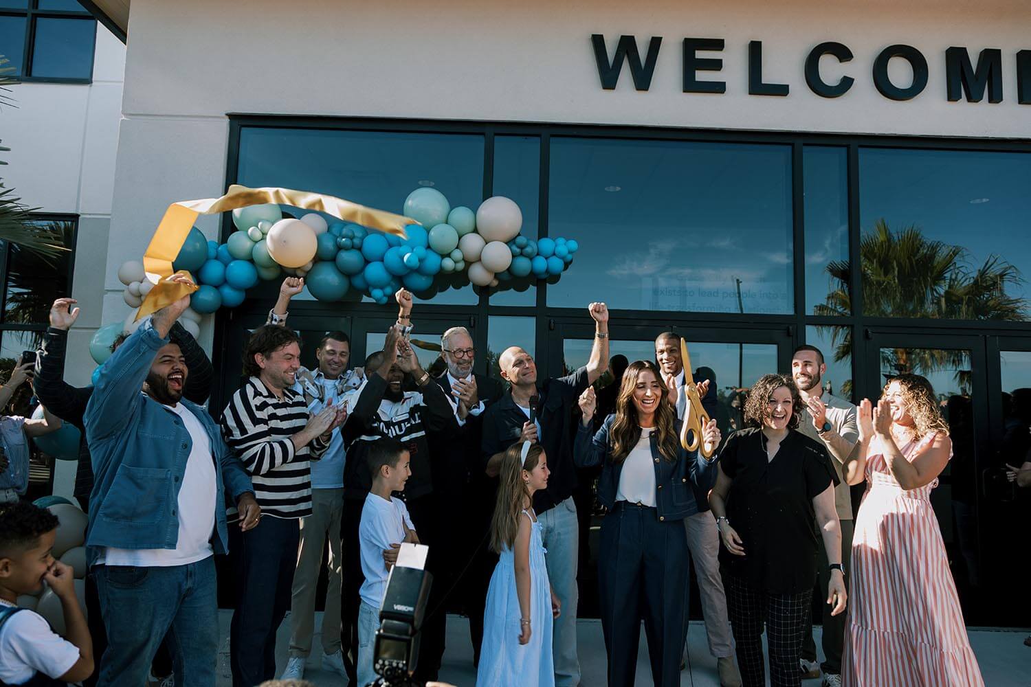 Grace City Church Electrical Design Build - people standing in front of building with balloons